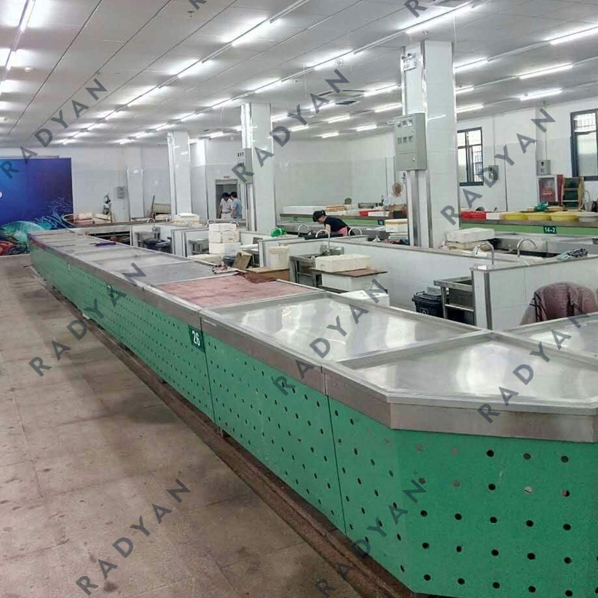 Farmers market transformation with fruit and vegetable racks, dividing table and fish pond