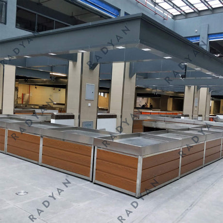 Farmers market transformation with fruit and vegetable racks, dividing table and fish pond