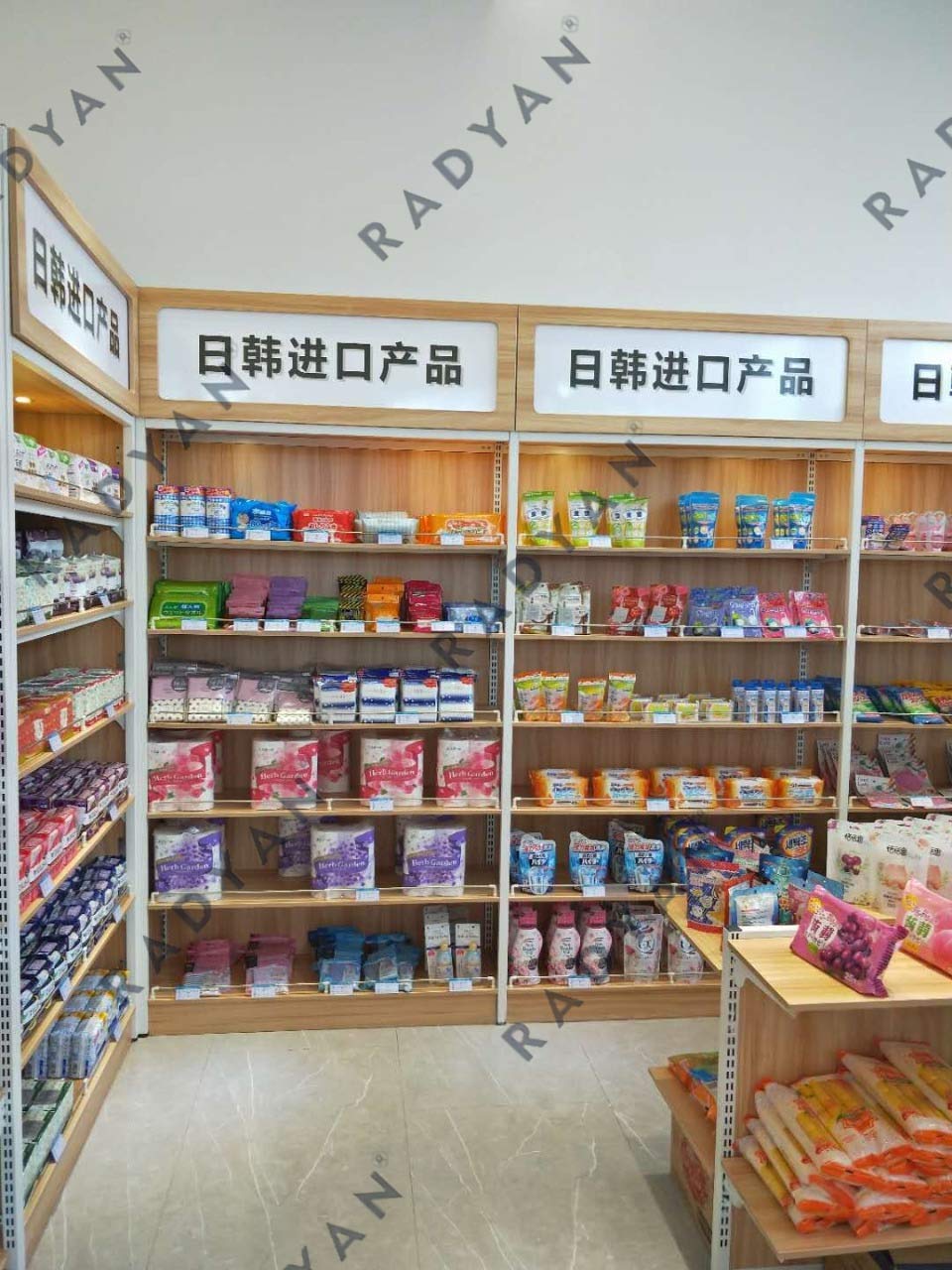 Supermarket convenience store steel and wood shelves against the wall