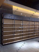 Supermarket convenience store steel and wood shelves against the wall